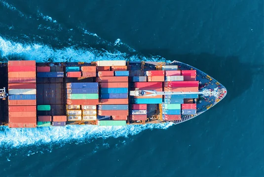 loaded cargo ship moving at sea