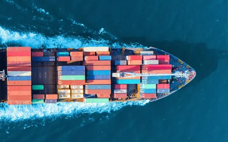 loaded cargo ship moving at sea